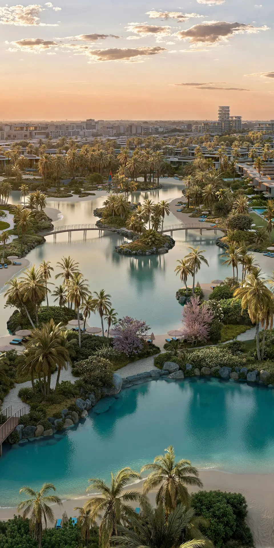 Bay Estate's lagoons at sunset, with villas and palms along the water