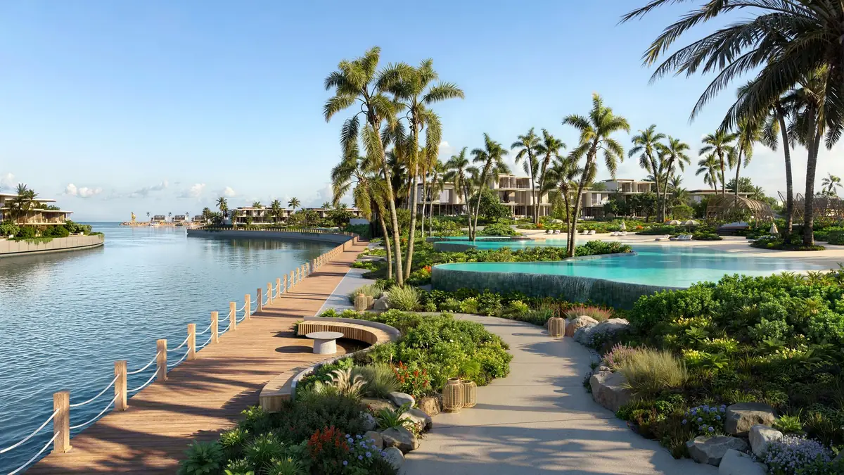 The promenade along the water, with a boardwalk, seating and pools beyond