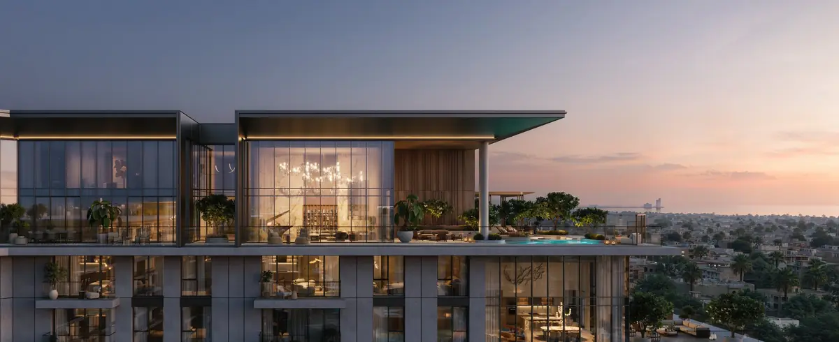 Crestlane 1 penthouse level at dusk, with its pool deck and the coast beyond
