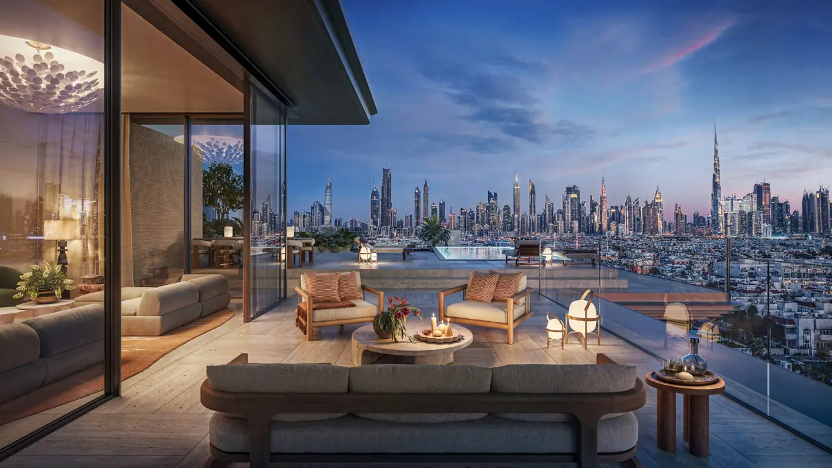 Penthouse terrace at dusk with the Dubai skyline