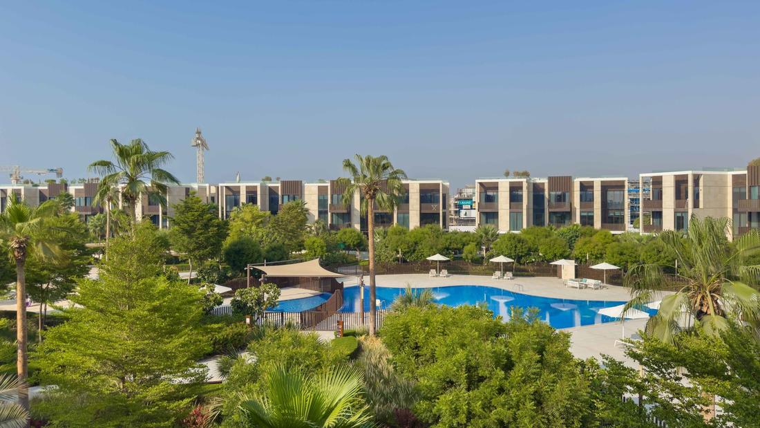 Jumeirah Bay community pool and landscaped gardens